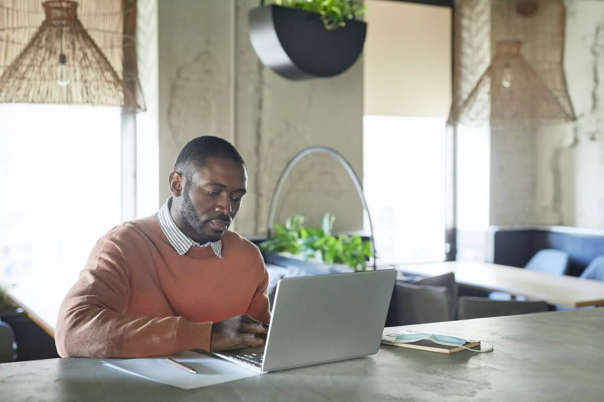African Businessman Working in Cafe