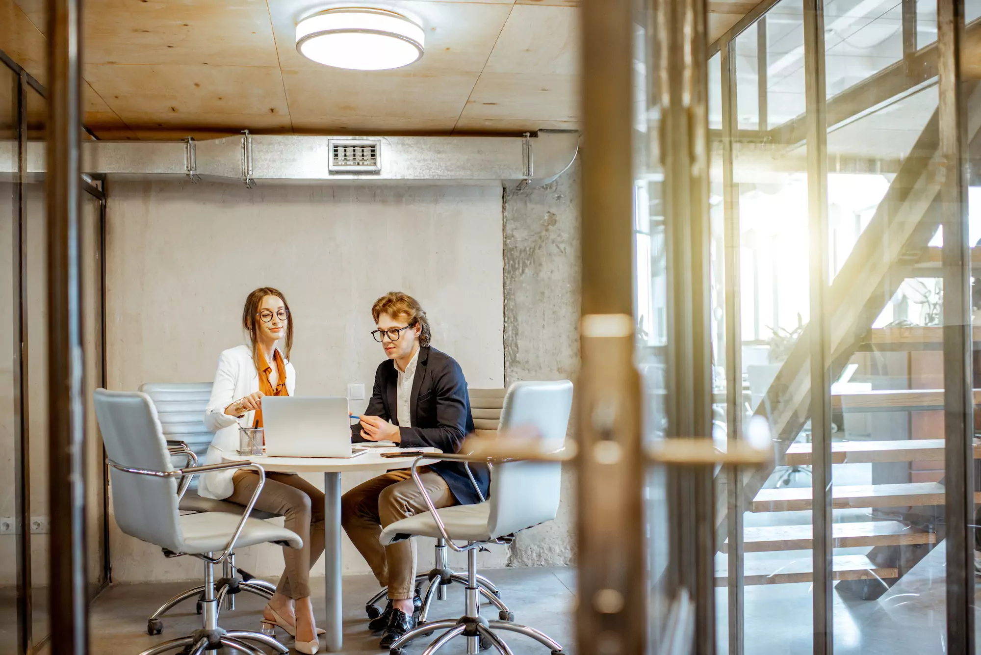 Businessman and woman in the meeting room