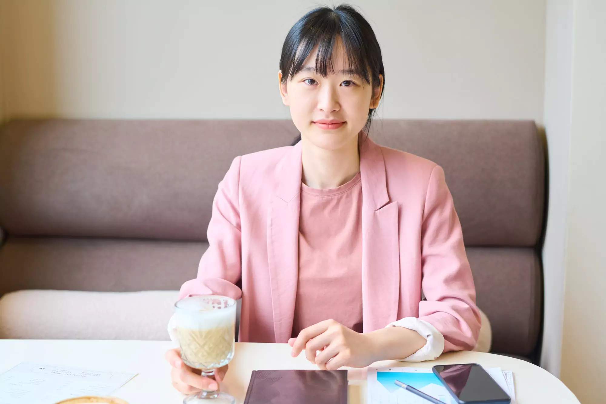 Businesswoman drinking coffee at restaurant