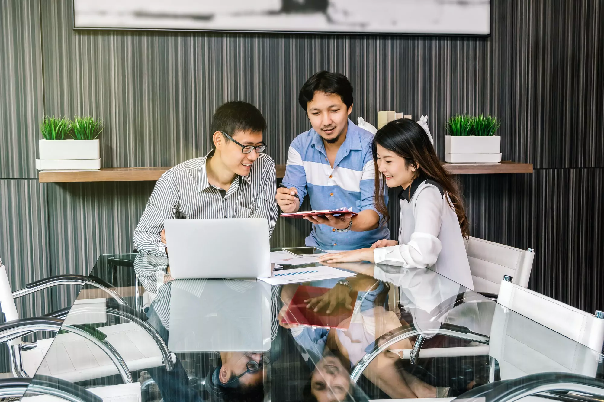 Group Of Asian Business people with casual suit meeting with relax action in the modern meeting
