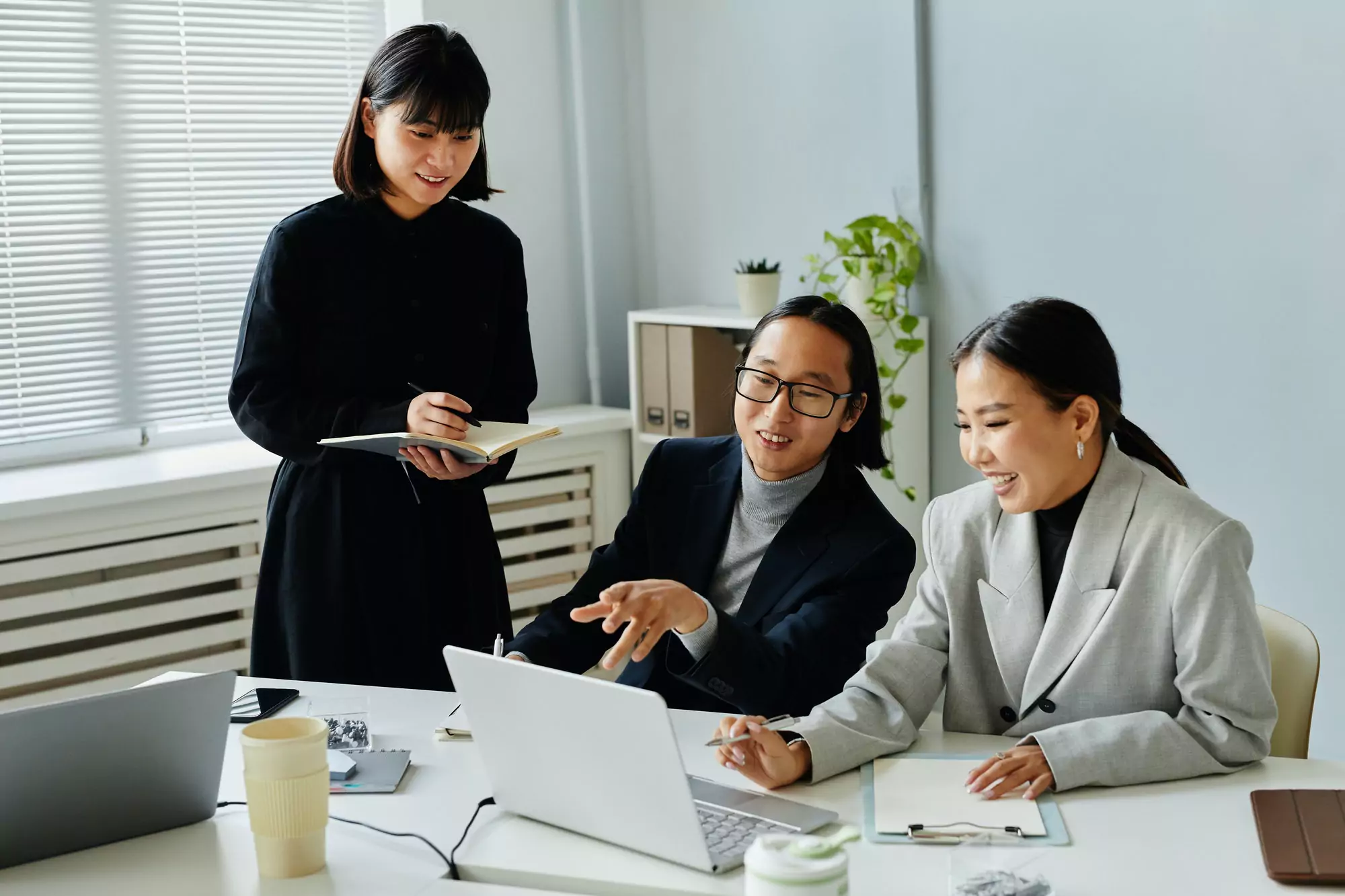 Smiling Business People Using Computer